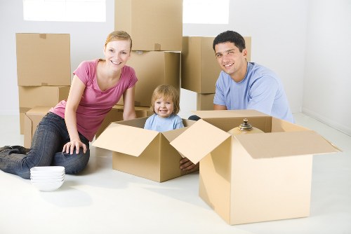 Home moving team handling household furniture in Woodford Green