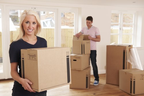 Packed boxes and furniture ready for a local home removal service