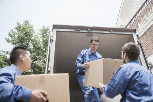 Trained movers using proper lifting and loading methods