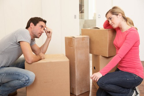 Boxes and household items prepared for collection by movers in Woodford Green