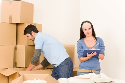 Furniture and boxes being loaded into a moving van