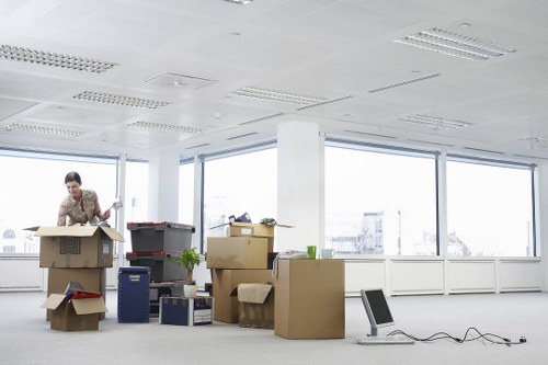 Packed moving boxes and furniture ready for local removal service