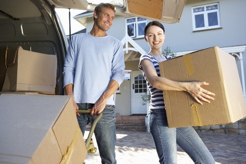 Local moving team loading furniture into a van