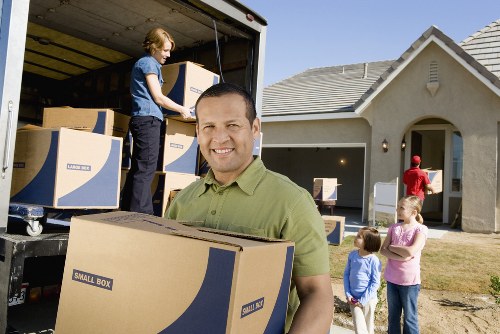 Local house moving team handling furniture and boxes