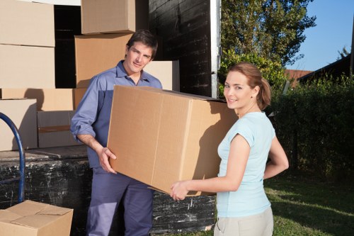 Packed moving boxes and furniture prepared for house removals in Woodford Green